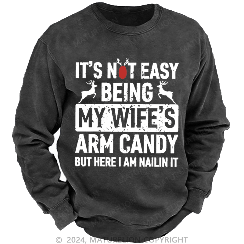 Maturelion Christmas Sweatshirt It's Not Easy Being My Wife's Arm Candy But Here I'm Nailing It Custom Sweatshirt