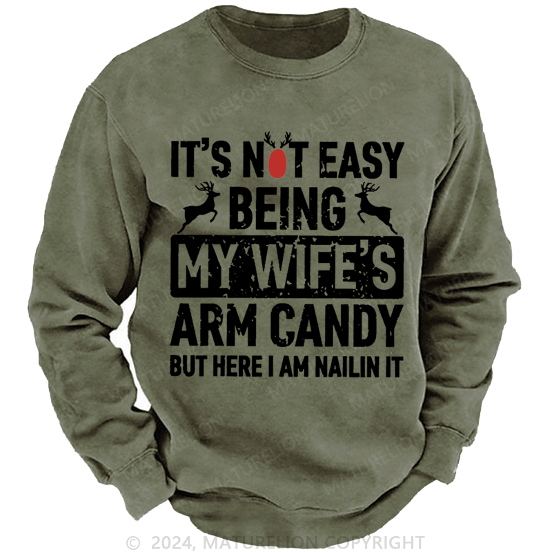 Maturelion Christmas Sweatshirt It's Not Easy Being My Wife's Arm Candy But Here I'm Nailing It Custom Sweatshirt