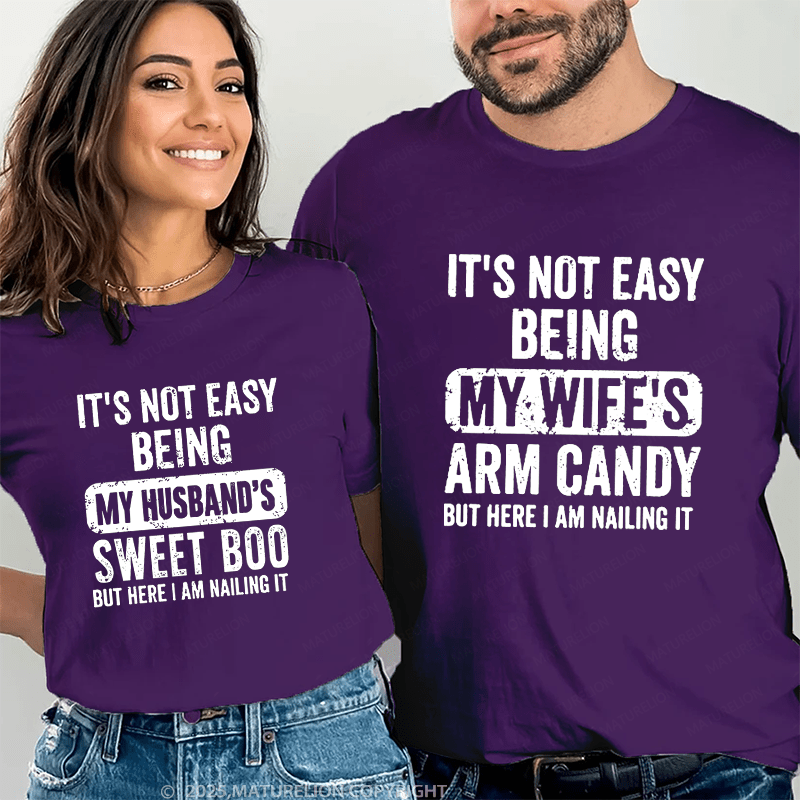 Maturelion It's Not Easy Being My Wife's Arm Candy But Here I Am Nailing It Couple T-Shirt